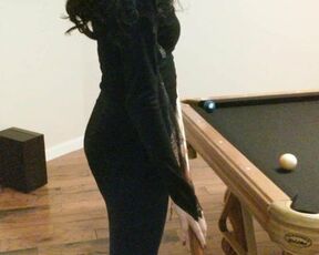 Morticia Addams plays pool