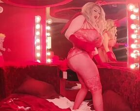 Bimbo showgirl shows off her huge fake boobs and huge fake booty