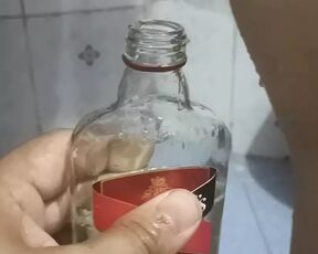 Bhabi pissing in rum bottle