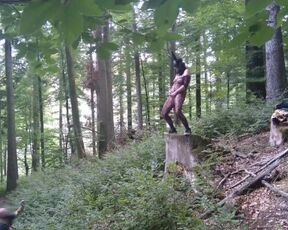 Standing pissing in a woods in a bunny mask and fishnet